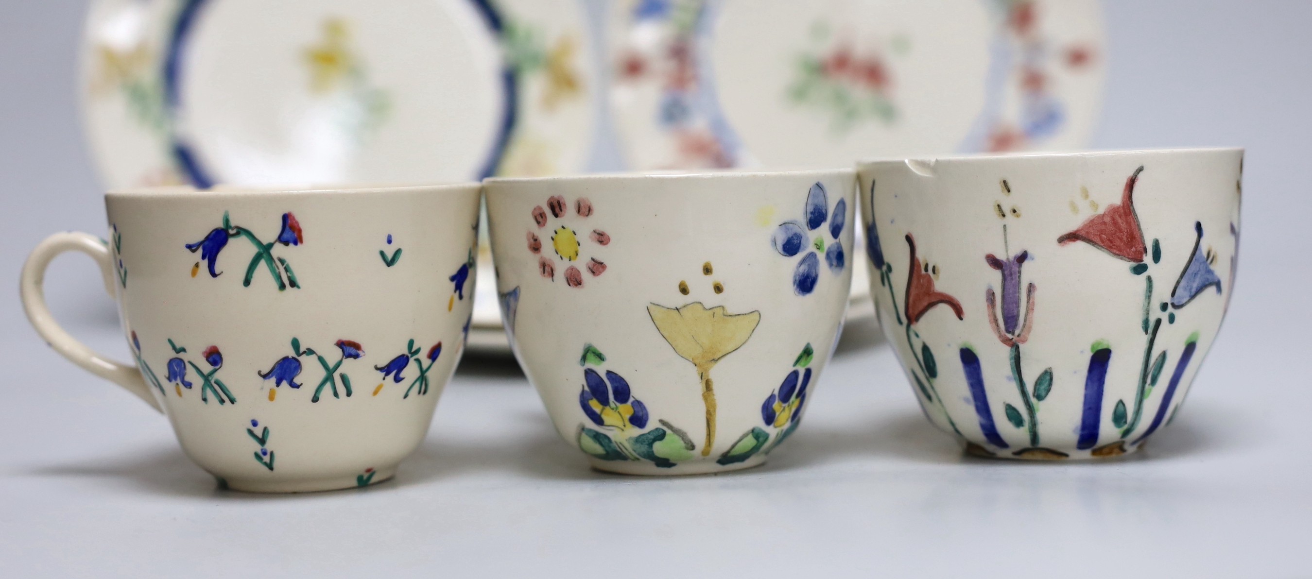 Jessie Marion King (1875-1949), four various floral design tea plates and three tea cups